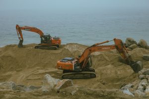 excavators moving sand 